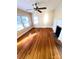 Bright living room featuring hardwood floors, fireplace, and natural light from the many windows at 716 E Union St, Marshville, NC 28103