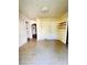 A large living room featuring fresh paint, built in storage, and tiled flooring at 716 E Union St, Marshville, NC 28103