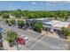 Aerial view of downtown commercial buildings on tree-lined streets, displaying the town's retail and community center at 804 Lyndon Station Dr, Pineville, NC 28134