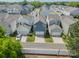 Aerial view of a residential neighborhood with blue siding homes and tree-lined streets on a sunny day at 804 Lyndon Station Dr, Pineville, NC 28134
