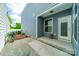 A concrete backyard patio shows the home's blue siding and a green lawn at 804 Lyndon Station Dr, Pineville, NC 28134