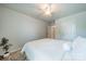 A serene bedroom featuring neutral walls, ceiling fan, and a large inviting bed at 804 Lyndon Station Dr, Pineville, NC 28134