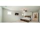 Inviting bedroom with neutral walls, ceiling fan, wall mounted TV and a view to the hallway at 804 Lyndon Station Dr, Pineville, NC 28134