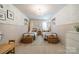 Charming bedroom featuring two twin beds, a decorative chandelier, and wallpaper at 804 Lyndon Station Dr, Pineville, NC 28134
