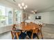 Dining room area near the living room featuring lots of natural light and modern decor at 804 Lyndon Station Dr, Pineville, NC 28134