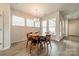 Dining room with modern lighting, a round table, and large windows providing natural light at 804 Lyndon Station Dr, Pineville, NC 28134