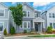 Charming two-story home with blue siding, white trim, and a beautifully landscaped front yard at 804 Lyndon Station Dr, Pineville, NC 28134