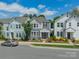 Charming two-story home with blue siding, white trim, and landscaped front yard on a sunny day at 804 Lyndon Station Dr, Pineville, NC 28134
