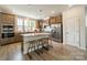 Modern kitchen with stainless steel appliances, a center island with seating, and white subway tile backsplash at 804 Lyndon Station Dr, Pineville, NC 28134