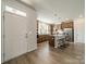 Bright kitchen featuring stainless steel appliances, a center island with seating, and light wood floors at 804 Lyndon Station Dr, Pineville, NC 28134