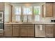 Kitchen with a stainless steel sink, granite countertops, stainless steel dishwasher, and wooden cabinets at 804 Lyndon Station Dr, Pineville, NC 28134