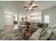 Open-concept living space flows from the kitchen to the dining and living area with modern furnishings at 804 Lyndon Station Dr, Pineville, NC 28134