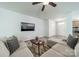 Living room area has a sectional sofa and TV at 804 Lyndon Station Dr, Pineville, NC 28134