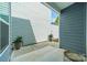 Outdoor patio with concrete tiles, decorative plants, and neutral color siding at 804 Lyndon Station Dr, Pineville, NC 28134