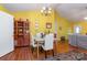 This dining area has decorative walls with a lovely china cabinet and access to the living room at 814 Independence Dr, Wingate, NC 28174