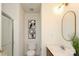 Bright bathroom with modern fixtures, updated vanity and decorative mirrors at 8233 Christmas Ct, Charlotte, NC 28216