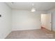 Spacious bedroom featuring neutral carpet and white walls, offering a blank canvas at 8233 Christmas Ct, Charlotte, NC 28216
