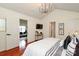 Primary bedroom features stylish decor and access to en suite bathroom and closet at 8233 Christmas Ct, Charlotte, NC 28216