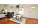 Cozy dining room with fireplace, and a large window to let in sunlight at 8233 Christmas Ct, Charlotte, NC 28216