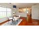 Dining room with a large window, and view to the kitchen at 8233 Christmas Ct, Charlotte, NC 28216