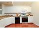 Kitchen with white cabinets and stainless steel appliances at 8233 Christmas Ct, Charlotte, NC 28216