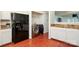 Kitchen with laundry machines and black fridge at 8233 Christmas Ct, Charlotte, NC 28216