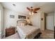 Relaxing bedroom with ceiling fan, wrought iron bed frame, side tables, and plenty of room at 8707 Darcy Hopkins Dr, Charlotte, NC 28277