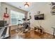 Cozy bonus room featuring musical instruments and a hardwood floor at 8707 Darcy Hopkins Dr, Charlotte, NC 28277