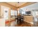 Cozy breakfast nook with a table and chairs, bathed in natural light, open to the living room at 8707 Darcy Hopkins Dr, Charlotte, NC 28277