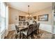 Formal dining room with a large table and elegant chandelier, perfect for entertaining at 8707 Darcy Hopkins Dr, Charlotte, NC 28277