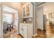 Transitional space featuring built-in cabinets that leads to a dining room and the kitchen at 8707 Darcy Hopkins Dr, Charlotte, NC 28277