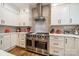 A fully equipped kitchen with stainless steel appliances, granite countertops, and custom cabinetry at 8707 Darcy Hopkins Dr, Charlotte, NC 28277