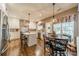 Spacious eat-in kitchen with an island, stainless steel appliances and fixtures, and hardwood flooring at 8707 Darcy Hopkins Dr, Charlotte, NC 28277