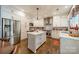 This kitchen features an island, stainless steel appliances, and an abundance of cabinet space at 8707 Darcy Hopkins Dr, Charlotte, NC 28277