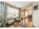 Sun-filled living room with beautiful hardwood floors and comfortable seating at 8707 Darcy Hopkins Dr, Charlotte, NC 28277