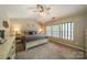 Relaxing main bedroom with vaulted ceiling, neutral color palette, carpeted floor, and a ceiling fan at 8707 Darcy Hopkins Dr, Charlotte, NC 28277