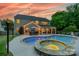 Expansive backyard features a stunning pool, inviting hot tub, and outdoor dining space with picturesque sunset views at 8707 Darcy Hopkins Dr, Charlotte, NC 28277
