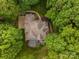 Aerial view showcases the house surrounded by a canopy of green trees, offering privacy at 9013 Yellow Pine Ct, Waxhaw, NC 28173
