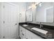 Bathroom featuring a double sink vanity with granite countertop and modern fixtures at 9013 Yellow Pine Ct, Waxhaw, NC 28173