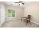 Bedroom featuring natural light and wood desk with chair at 9013 Yellow Pine Ct, Waxhaw, NC 28173