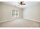Bedroom featuring natural light, neutral carpet, and ceiling fan at 9013 Yellow Pine Ct, Waxhaw, NC 28173