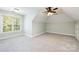 Bedroom features light green walls, natural light, and neutral carpet at 9013 Yellow Pine Ct, Waxhaw, NC 28173