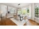Bright dining area with hardwood floors, modern light fixture, and natural light at 9013 Yellow Pine Ct, Waxhaw, NC 28173