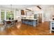 Modern kitchen with a large center island, stainless steel appliances, and an adjacent breakfast nook at 9013 Yellow Pine Ct, Waxhaw, NC 28173