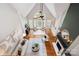 Open living room boasts vaulted ceilings, large windows, hardwood floors, and neutral decor at 9013 Yellow Pine Ct, Waxhaw, NC 28173