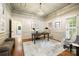 Home office features a coffered ceiling, hardwood floors, and wainscoting at 9013 Yellow Pine Ct, Waxhaw, NC 28173