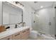 Stylish bathroom featuring modern vanity, sleek fixtures, and a glass-enclosed shower with a view at 910 Everett Pl, Charlotte, NC 28205