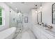 Bathroom suite with soaking tub, glass shower, double vanity, and elegant finishes at 910 Everett Pl, Charlotte, NC 28205
