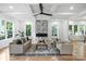 Bright living room with coffered ceilings, modern fireplace, hardwood floors, and large windows at 910 Everett Pl, Charlotte, NC 28205