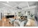 Open-concept living room flows into the kitchen, highlighting hardwood floors and plenty of natural light at 910 Everett Pl, Charlotte, NC 28205